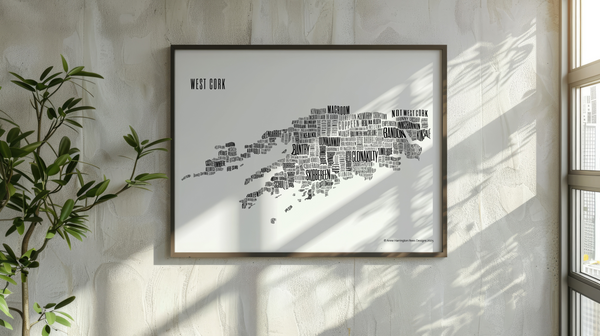 West Cork placename map in black ink, designed by Anne Harrington Rees, framed, hanging on a wall with shadows