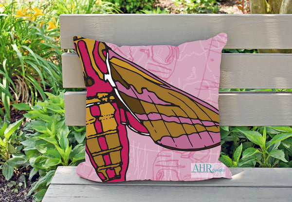 Colourful gift – Pink, Mustard, Yellow, White and Brown Elephant Hawk Moth design cushion on garden bench.
