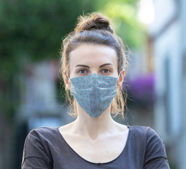 Woman wearing Anne Harrington Rees' Kelpie Face Mask