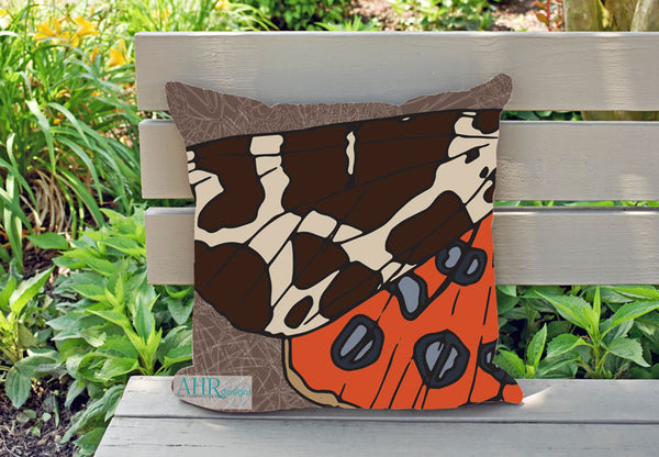 Colourful gift – Brown, Orange, Cream and Blue Garden Tiger Moth design cushion on garden bench. Designed by Anne Harrington Rees. Designed, printed and made in Ireland.