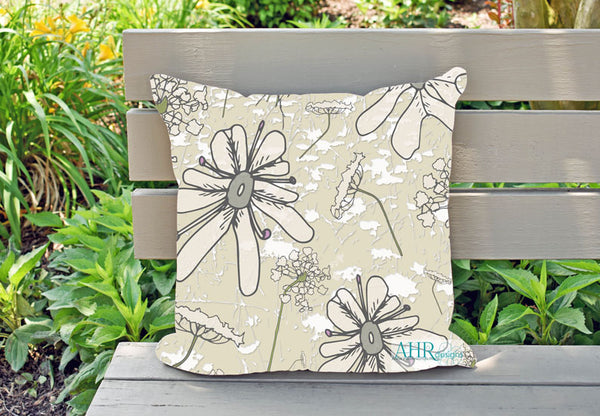 Colourful gift – Cream, Pink, Green and Grey Wild Carrot flower design cushion on garden bench. Designed by Anne Harrington Rees. Designed, printed and made in Ireland.